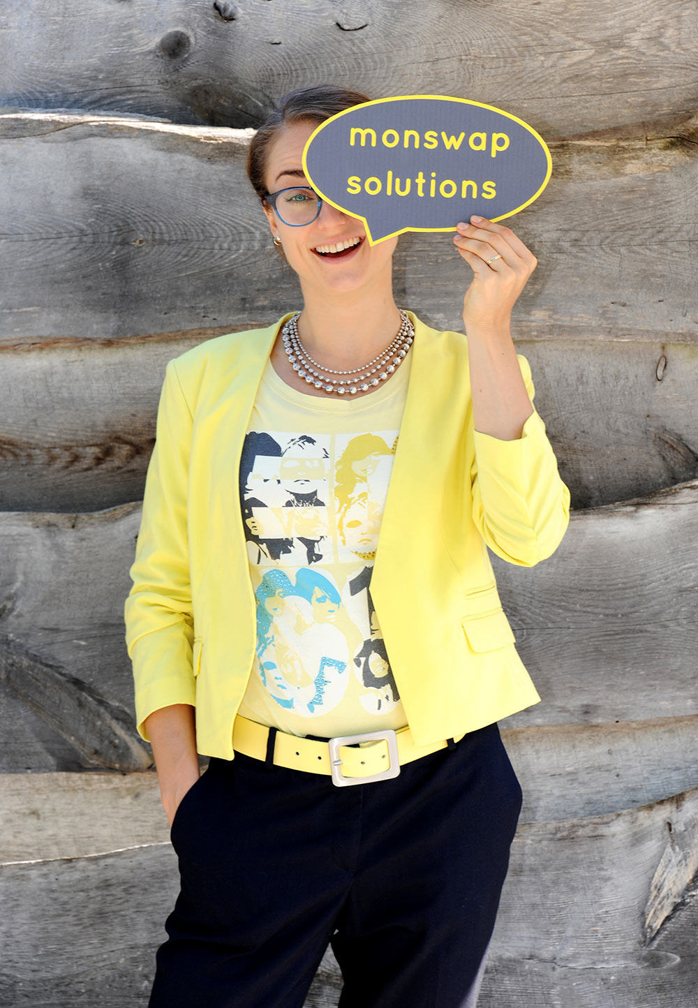 Freelance German copywriter Monika Weber holding a sign that says monswap solutions